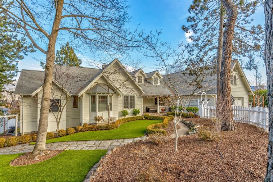 Charming single-level Cape Cod sited on one of our city's largest private residential lots, in a highly desirable, tranquil, centrally located neighborhood. Features include soaring view windows, vaulted ceilings, fireplace, radiant heated oak floors, abundant storage areas, and crystal light fixtures. Airy updated kitchen is equipped with butcher block island and eating bar, granite counters, artistic tile backsplash, and new stainless appliances. Adjacent to the kitchen is a light-filled sitting area surrounded by windows, and the dining area opens to a spacious composite deck with retractable awning. Master suite has a large walk-in closet and updated bath with dual vanity, granite counters, and tile backsplash. Terraced grounds are totally irrigated with an updated system using TID water, attractive landscaping, raised vegetable beds, mature rhododendrons, apple and peach trees. Per county assessor, main living area is 2299 SF and bonus room over 2- car attached garage is 258 SF.