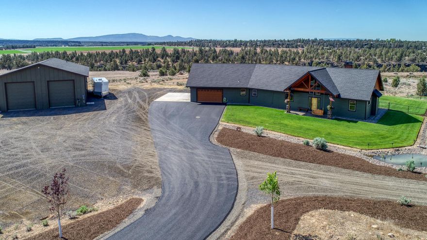 Builder's own home. Nearly 40 acres on Crooked River near BLM lands. Bringing the outside in, large banks of windows provide outstanding views of snow capped mountains., green pastures, river canyon & rock outcroppings. Prepare to be pleasantly surprised with Acacia flooring, snag/tree accent, floor to ceiling rock fireplace, & knotty alder doors & trim. Open kitchen features full size, side by side frig/freezer, 42'' range & granite. Large master suite & beautiful bath with open, tiled shower & soaker tub. Two bedrooms joined by Jack & Jill bath. 2nd floor bonus room is perfect for game room, theater or workout with rough plumb for bar. Very convenient plan with large mudroom/laundry & office. Don't worry about room for toys with attached , oversized garage AND detached 40x60 shop with full bath & lots of storage. Hunt or fish the river or just enjoy the wildlife; waterfowl otters, deer & elk. Ride out from the property into BLM that leads to 1000s of acres of National Grasslands.