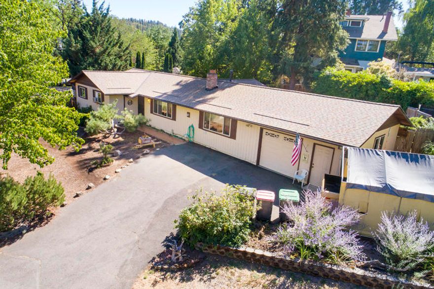 Single level home in the heart of the charming town of Jacksonville! Enjoy the close proximity to shopping, restaurants and the Britt Festival. The home boasts a generous 1,858 Square Feet with 3 bedrooms and 2 bathrooms. A large family room and living room with fireplace make this the perfect home for entertaining guests. 0.24 acre lot size gives you just enough privacy from your neighbors. New roof in 2018. Don't miss out on the opportunity to live in the heart of Jacksonville!