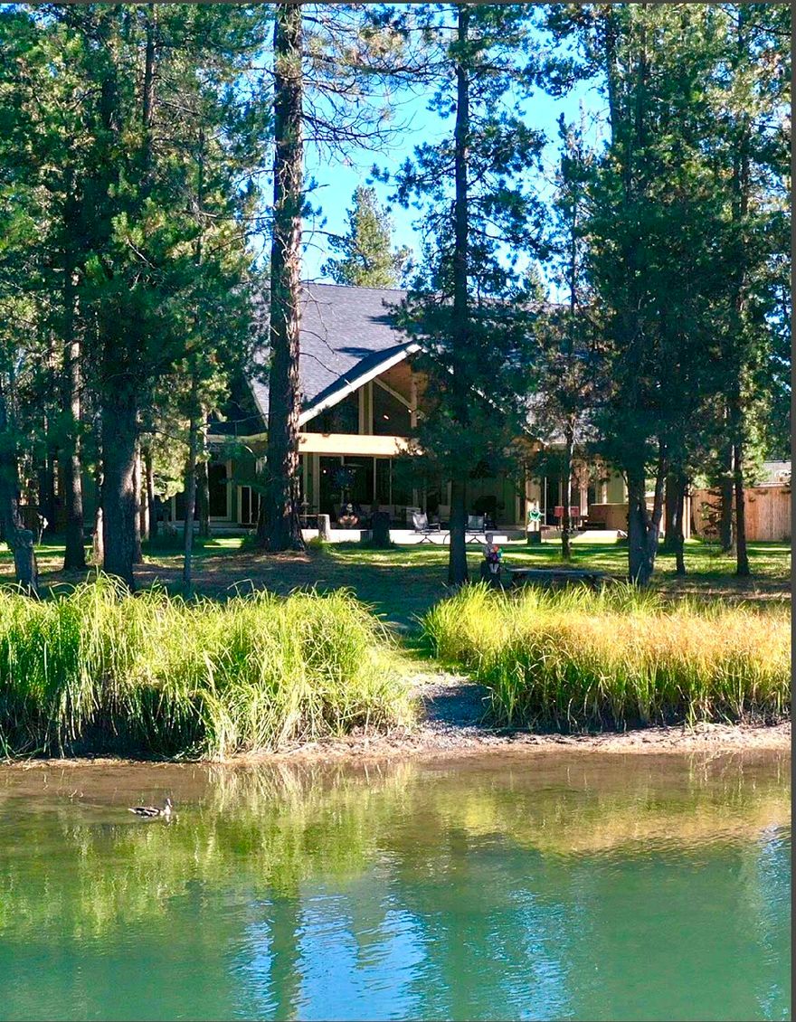 Come see this beautiful custom built home nestled along 125 feet of private access to the Big Deschutes River. This home features 3 bedrooms and 3 full bathrooms, in addition to an extra office space and upstairs loft with a breathtaking view of the river. Enjoy over 1000 square feet of covered porch while relaxing in your own backyard oasis.  Included with the home comes 1090 square feet of garage space with the ability for RV parking and ample storage. RV hookups and sewer dump are on site as well as fully landscaped front and back yard with multi zone heating and cooling system accessed from your cell phone. BONUS this home is in the county making it available for a  short term vacation rental. Welcome Home!