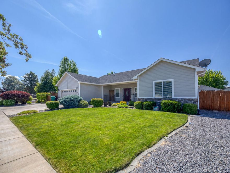 A beautifully maintained home in the desirable Regency Estates neighborhood of Klamath Falls. This spacious single-level property offers 3 bedrooms, 2.5 baths, and 2,098 sq ft of thoughtfully designed living space. The open-concept layout features vaulted ceilings, a cozy gas fireplace, and large windows that fill the home with natural light. The gourmet kitchen is a chef's dream with Corian countertops, custom soft-close cabinetry, stainless steel appliances, and a walk-in pantry. Quality finishes like bamboo flooring and upgraded insulation add warmth, efficiency, and long-term value. Situated on a 9,150 sq ft corner lot, the outdoor living space is just as impressive. Enjoy beautifully landscaped yards, dual patios, and a full irrigation and drip system—perfect for entertaining or evenings under the stars. The oversized two-car garage provides extra storage, and the extended driveway offers room for RVs, trailers, or guest parking. Just minutes from parks, shopping, and trails.