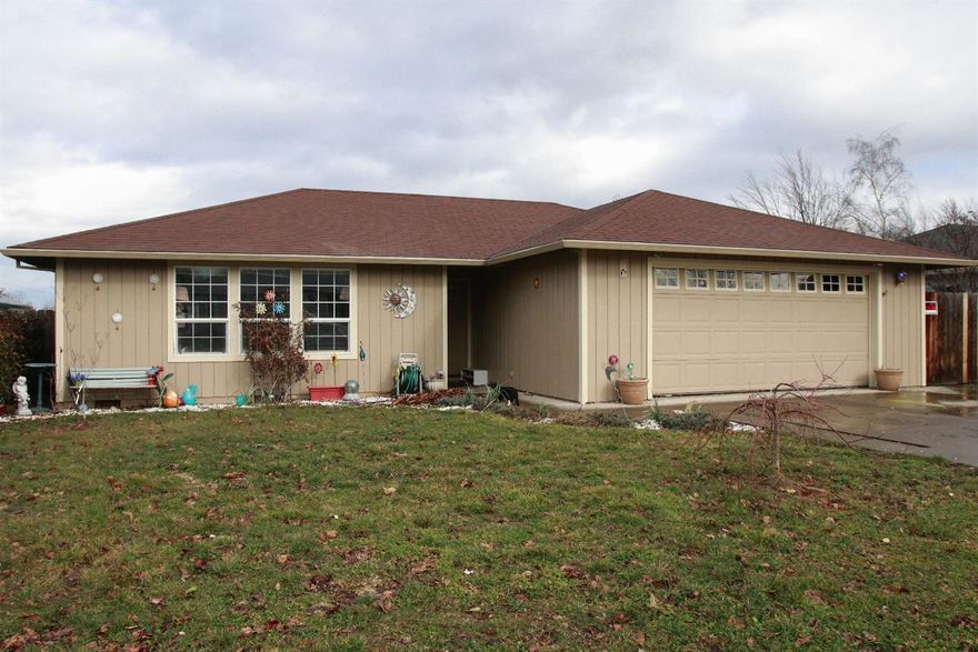 Make an easy appointment with your agent to view this 1994 built, 3 bedroom, 2 bathroom home. Spacious living area with recessed ceiling and great outdoor lighting entering from the front and side windows. Master suite looks out to the backyard. Separate laundry room leads to the two car garage with plenty of hobby storage space. Gated RV parking. Covered patio. Back yard offers a garden area, chicken coup, and plenty of space for more!