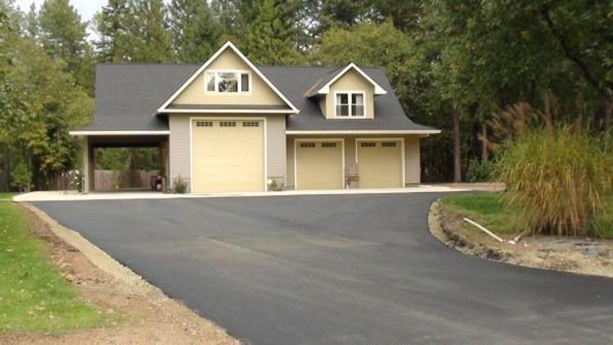 Serene and secluded- just minutes from town. You will love the peaceful feel of this delightful home positioned perfectly on its 2.5 acres of flat, usable land. Features include 2 bedrooms with an office/den that could be a third, 2 full bathrooms, and an open floor-plan. Large 2-car garage,RV garage, detached 1 car garage with large shop (could possibly make great guest quarters) offer tons of space for all of your hobbies and toys. Fully fenced and gated property with a garden area surrounded by a dear fence make the outdoors your refuge. Rare to find such vast spaces and features so close to town, RCC and still in district 7. Come tour today!