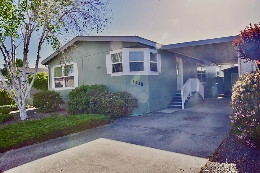 Very well maintained manufactured home in Willow Estates Mobile Home Park.  Willow Estates is a 55+ community located on the southwest side of Grants Pass.  Ready to move in!! This home has natural lighting throughout the house.  Two bedrooms PLUS a den/office. Vaulted ceilings and living/dining combo that creates a large open living space.  Many upgrades in this home-mini blinds, extra large windows, alder cabinets, fancy toiled w/bidet in main bathroom, two car carport, 8x12 storage shed/shop and mud/laundry room with a pantry and plenty of extra storage.  All kitchen appliances, washer/dryer are included in the sale. We all know this won't last long!! Don't wait! See this home today! Willow Estates does allow one small pet. Monthly space rent will be $600.  Park approval must be obtained for potential buyers.