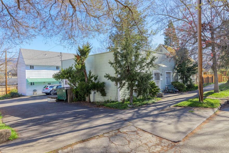 Duplex plus a stand alone SFR located on a beautiful tree-lined street in downtown Ashland's Railroad District.  Close to Ashland Food Co-op, Lithia Park, shops, restaurants and just minutes to SOU.  The single-story SFR stand alone building in front (#165) features 918 S/F with one bdrm/bath.  The 2-story building in back features two units with separate entrances:  #161 (upstairs) is 525 S/F with one bdrm/hall bath., and #163 (downstairs) is 785 S/F with one bdrm/bath.  All units have a kitchen/living room/bath.  There is also a studio upstairs (Unit 161.5) that is currently being used as a longer term (30+ days) Airbnb rental, featuring a bathroom/shower/kitchenette.  Common area laundry room (downstairs) serves all units, plus onsite and street parking.  There is a 10ft dedicated alley/walk-way (5ft on this property) on the west side (see plat map).