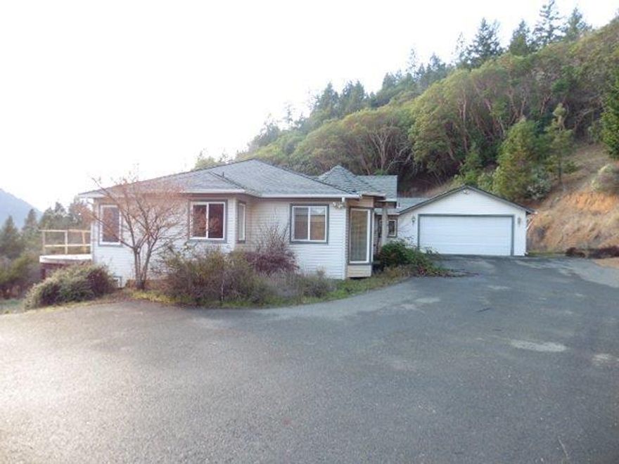 Close in rural setting offers great mountain and territorial views. Home offers 4 bedrooms, 2.5 bathrooms. Main level offers a light filled living room, large dining room and kitchen and office. Lower level offers more bedrooms and a large bonus area. Lots of potential!