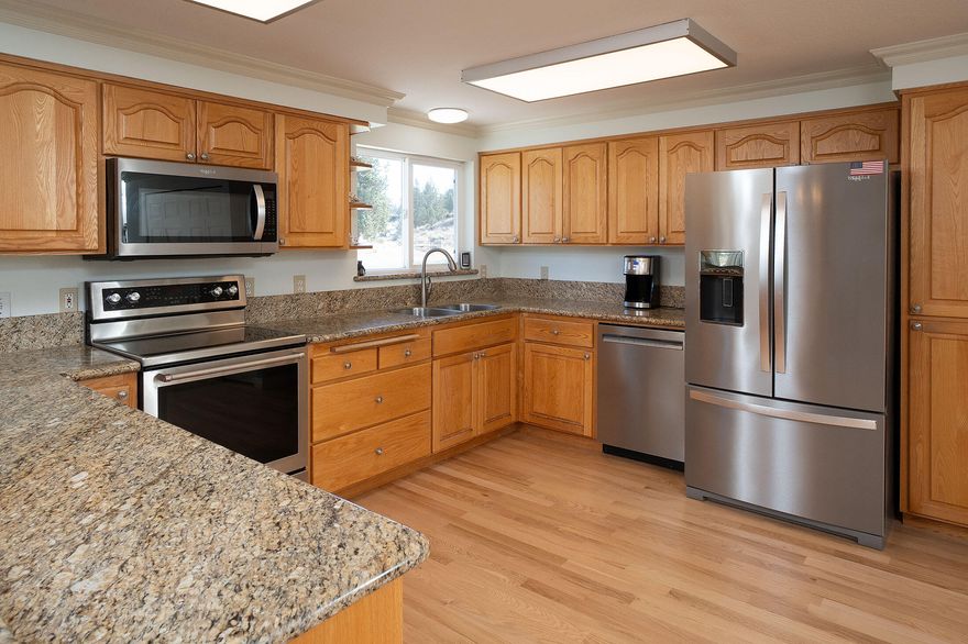 A BREATH of FRESH AIR — this single-level home offers privacy on 7.9 acres, nicely updated with newer carpet, hardwood floors, fresh paint in and out, new roof and gutters in 2020, new French doors, new appliances, and nicely sized bedrooms including a large primary. Many large windows allow sunlight to shine in. Granite countertops enhance the elegance of the kitchen and baths. An oversized garage includes a heated shop with an office and bathroom. There is another small shop with electricity that can be used as a hobby room, plus an additional large shed for storage. The Crooked River Ranch community offers many great amenities including road maintenance, golf course, hiking paths, pool, pickleball, eateries, and a small market.