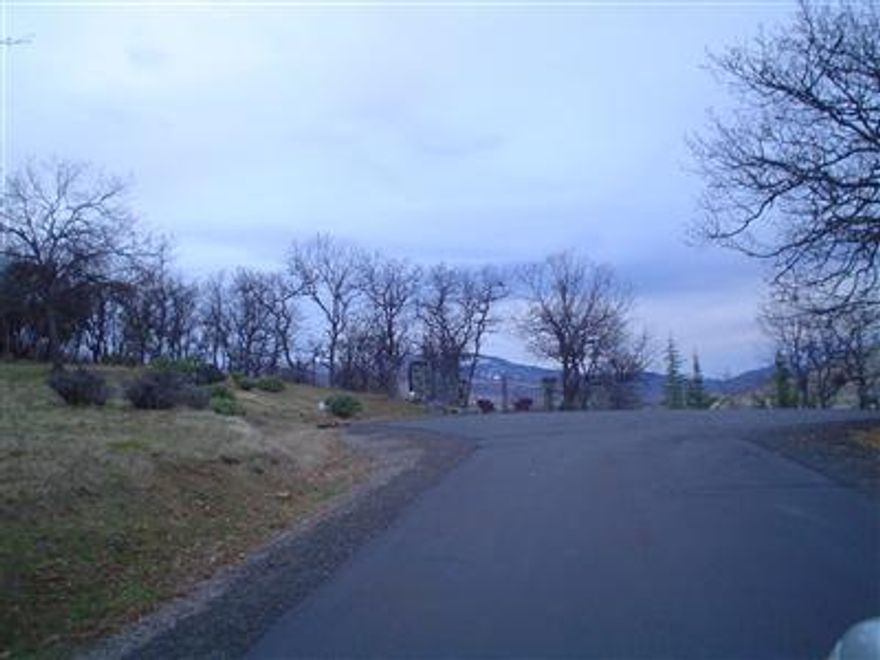 With 20% down, Seller will carry note for the remaining principal, secured by a 1st trust deed, at 6% interest, amortized over 30 years, with all principal and interest due in 5 years. Development opportunity for a gated rural subdivision consisting of 9 one acre lots. All lots are flat. Most of the engineering has been completed. County and DEQ had previously approved subdivision, now expired. Plan includes a community septic system that was approved by DEQ prior to halt of construction. A community water system is planned and partially installed with service from 3 high production wells. Mainlines for storm drains, electric power, phone, cable and street lights are installed underground. Private road is ready for paving. The property is just 5 minutes from downtown