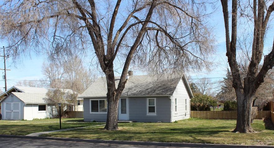 Great investment potential on double lot. Zoned for a variety of commercial and residential uses. Good rental history, now vacant. Detached garage/shop, alley access and RV parking. Sold as is.