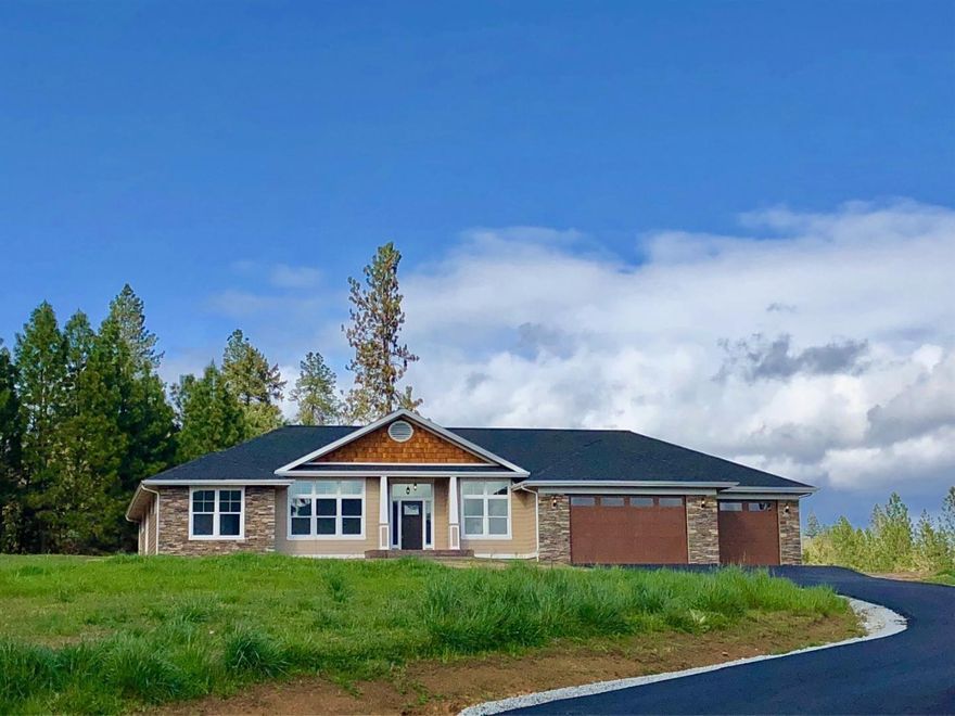 Brand new custom built 4 bedroom 3 bath home on 2.54 rolling acres with long range mountain views. Home offers a large covered patio with pass through counter for easy kitchen access. 2 master suites, hardwood, tile and carpet flooring. Granite counter tops, vaulted ceilings, formal dining rm. 4 car finished garage. There is room on the property to build a shop or to develop for RV parking. River front park just down the street for fishing and boat access.