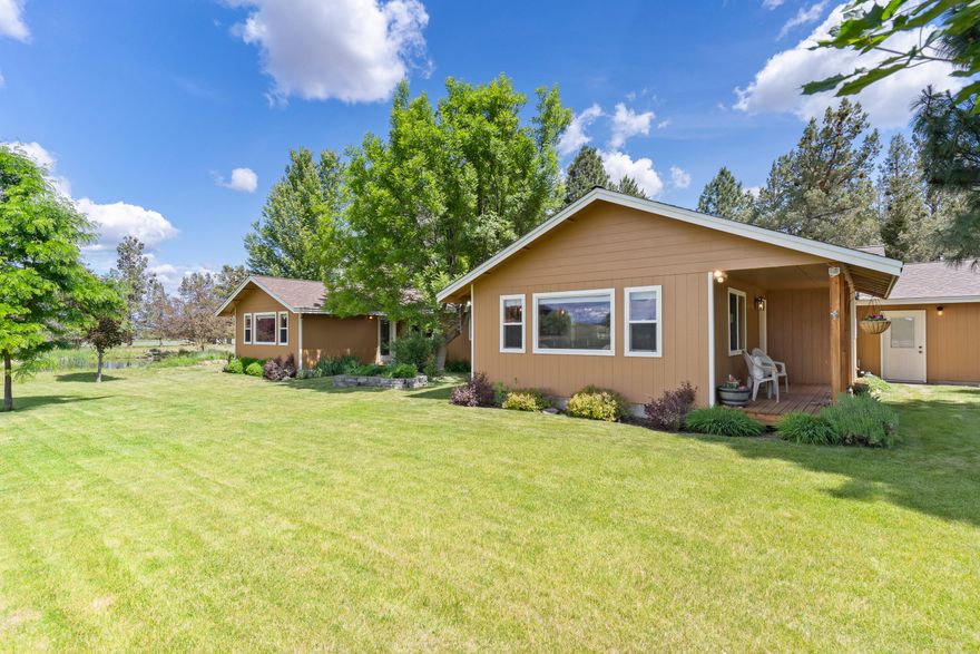 Tumalo hobby farm on 4.55 acres with stunning CASCADE VIEWS! Property classified for farm use with 4.5 acres of TID irrigation rights, 2 ponds & underground sprinklers. Property is fenced/cross-fenced, horse setup w/3-stall barn, tack room, hay barn & loafing shed. SINGLE LEVEL home renovated in 2005 to add a 2nd primary bedroom & living room. Kitchen remodeled in 2020 to include knotty alder cabinets, quartz countertops, walk-in pantry, Ruvati farm sink, Bosch dishwasher, black stainless LG refrigerator & induction range. Large primary suite w/vaulted ceiling, bath w/tiled shower, tile counters & floors w/radiant heat, soaking tub & 2 sinks. Features include luxury vinyl wood floors, knotty alder solid wood doors/trim, solar tubes, ceiling fans, new carpet, newer furnace & heat pump. Mud/laundry room with sink & storage. 3-car tandem garage, 3rd bay used as workshop. Private well with filtration system & storage shed. Hay barn is perfect for RV/Coach storage. 2-year old roof and more!