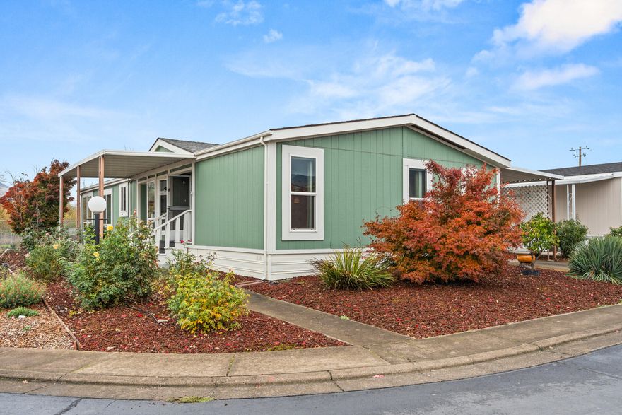 This home radiates charm and comfort with wonderful curb appeal, newer vinyl windows, a newer HVAC system, and many thoughtful upgrades throughout—truly move-in ready. The beautifully landscaped yard offers a sense of privacy with no homes behind, creating an open and peaceful backdrop. Tucked away on a quiet cul-de-sac in a smaller, well-kept park, it features an open floor plan that feels bright and spacious, along with great work sheds for storage or hobbies. Located in a friendly 55-and-better community with affordable space rent of just $600 per month including water, sewer, and garbage—this home is as inviting as it is economical.