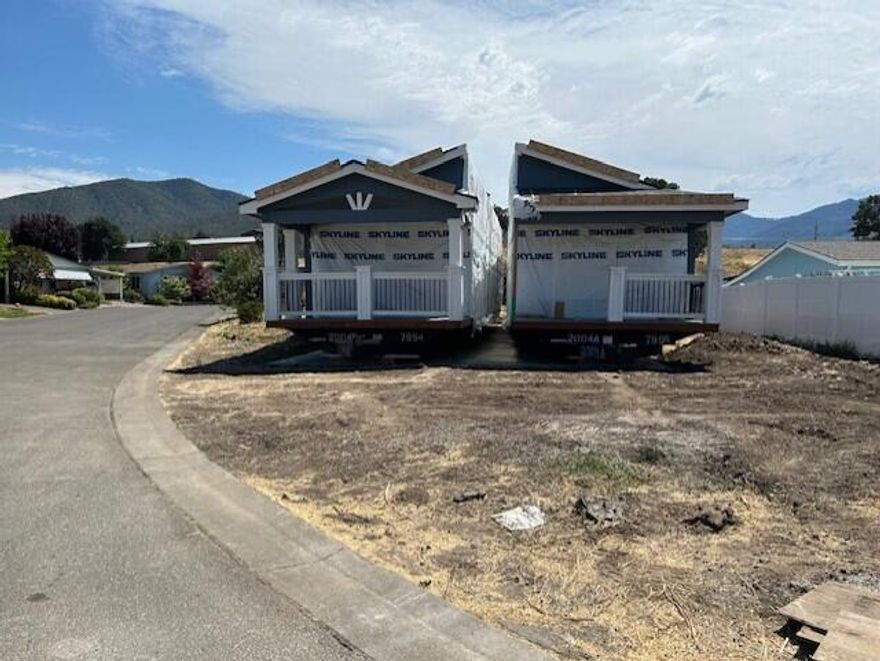 Here's a new listing #165 in popular Mountain View Estates, a 55+ community. Mountain View Estates is still owned by the local family that developed it in 1987. 21 homes of the 164 homes survived the Alameda Fire of 2020. The park is being restored & is now welcoming new and returning residents to this vibrant community. There's a brand-new dog park and mailbox kiosk with parking at the entry. This new Skyline 3 bedroom, 2 bath home has cathedral ceilings throughout. Double vanity in the bathroom with a step-in shower & linen closet. The kitchen & living area are in the front with views of the neighborhood. There are plenty of granite counters, cabinets, pantry & center island to please the cook. You've got plenty of space for your cars under the carport. Vinyl fencing & drought tolerant landscaping included along with sewer & trash. One small pet up to 25 lbs allowed. Interesting? You bet.