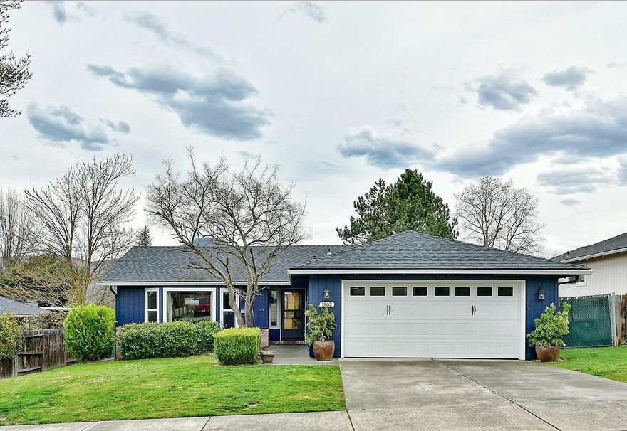 Beautiful home with tons up upgrades throughout! Spacious living room features vaulted ceiling and new laminate flooring. Brand new kitchen with granite countertops, custom soft-close cabinetry and the view of Roxy Ann will make doing the dishes much more enjoyable. Both bathrooms have been completely remodeled and look fabulous! Spacious master bedroom has a huge window with views of Roxy Ann. Home has all new windows, slider, front doors, newer roof, exterior paint, gutters and garage door. Large backyard feels private and is a great place to unwind after a long day. There is room for RV parking on the side of the house if you need a place to store your toys. This is a lovely home in a great neighborhood, call today for your personal tour!!