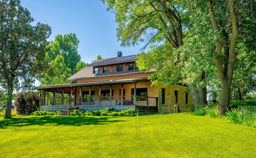 Experience a unique blend of Bend history and modern comfort on this 2.42-acre property with .9 acres of senior COID water rights. First homesteaded in 1911, the land now hosts a meticulously updated 1929 stone farmhouse and a beautifully revitalized original cabin. The 4-bed, 3.5-bath main residence pairs classic craftsmanship with refined finishes, updated systems, and dual primary suites. A generous 5-bay garage with workshop enhances the versatility, while the wraparound covered deck offers an inviting space to relax, entertain, and take in views of the orchard, irrigation pond, and peaceful landscape. Recent price adjustment reflects the decision to separately list the adjoining pasture, which is its own legal lot-see 61855 Dobbin Rd. May be bought separately or together. A rare opportunity to own a private retreat, small farm, or legacy homestead just minutes from town. For more Info see Recent Podcast here : bit.ly/3Y4orzI