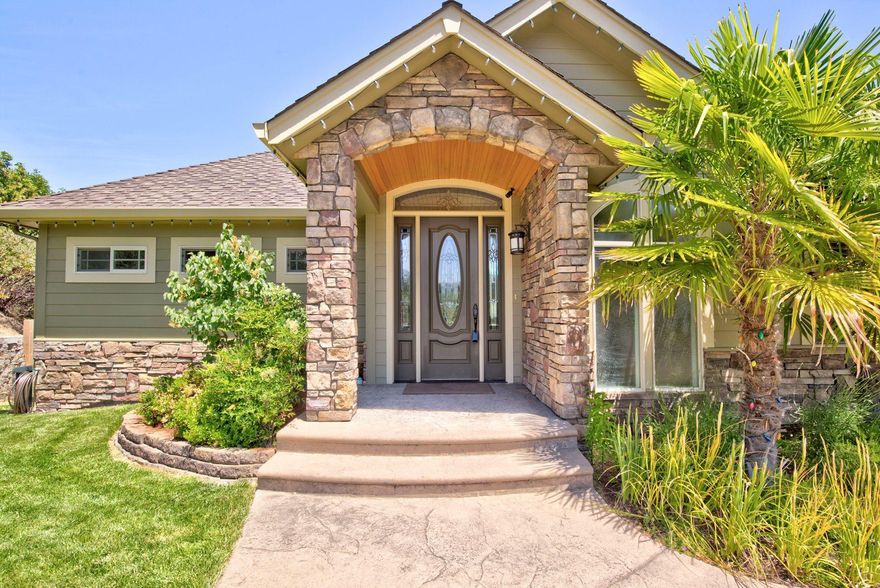 Stunning city views from the top of Starlite Pl. This executive style home features over 3900 sf on .35 acres.Built in 2006 by Cliff Woodruff, this property offers 4 bedrooms and 3 baths. The main level has a vaulted living room with picturesque windows, gas fireplace, chef's kitchen with granite counters, eating bar, hickory cabinetry and flooring, island, walk-in pantry, gas cooktop, wall oven and microwave, outdoor patio, dining room, master suite with its private patio, large walk-in closet, master bath with soak tub, shower, guest bath and laundry closet. Downstairs are 3 bedrooms, laundry room, full bathroom, family room with gas fireplace, storage rooms and French doors to the backyard. Included is a new Big Kahuna hot tub/spa and gym with sauna. New wood flooring, tile, crown molding, central vacuum, ceiling fans in every room, exterior painted in 2016, new hot water heater & back patio with gas fire pit. City views from every room makes this gem of a home ready to call yours.