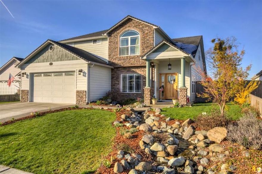 Spring into this open home boasting a bright & airy feel. Very large 4 bedroom 2.5 bath 3,133 sq. ft. home with lots of room for the family. Bedrooms are spacious and there are several living areas including a family room with high vaults, a formal living room and a 12' X 15' upstairs loft that is open to the family room below. Main floor master is spacious with large walk-in closet, jetted tub, double vanity and dual headed shower. Kitchen features granite counters, stainless steel appliances and a nice pantry area. The main living areas have lovely hardwood or tile floors and the living room has a gas fireplace. Out front is a lovely water feature that greats you and your guests and out back is a very large deck that takes in the great views of the western hills. This well-kept home is centrally located between Central Point and Medford within minutes to the airport, mall, schools and medical.