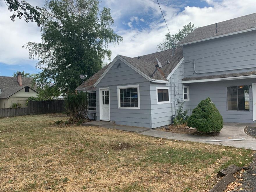 Newly renovated, spacious home in a quiet neighborhood! Don't miss this 3 bed (potentially 4), 2 bath home with over 1700 sq. ft. with an attached garage. Remodeled inside with new paint, floor, windows, doors, fixtures and more. Featuring two living areas, breakfast nook and large finished attic space, there is plenty of room to spread out. Located on over 1/3 of an acre, the possibilities are endless in the backyard. Great space for gardening and also featuring a nicely-sized detached workshop with carport. Ready and waiting for you to move in - hurry before it's gone!