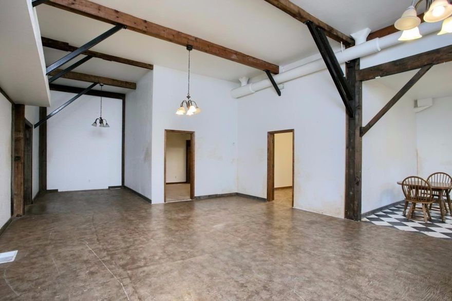 Great investment opportunity! Located near the upcoming Talent Gateway Development. This unique property offers the perfect mix of Residential and Commercial possibilities in a highly visible location. Ideal for someone looking to live upstairs and have your business downstairs. Nice spacious 3 bedroom, 2 bath residence (approx. 2,300sqft) above large commercial space downstairs. There is also an additional studio with a separate entrance off the commercial space downstairs. This historic barn was previously home to an antique store and an attorney's office with endless opportunities for its new owner. 9 plus parking spaces and attached 2 car garage.