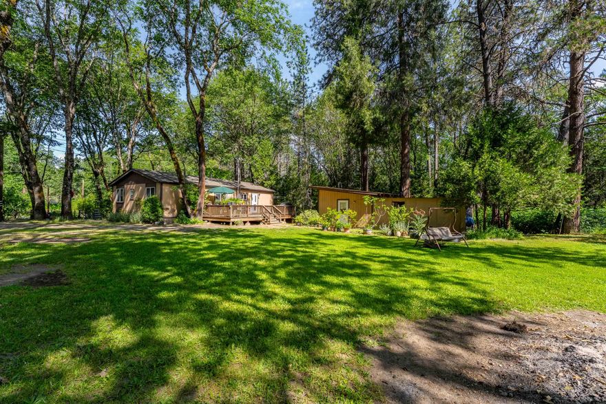 Price Improvement! This home is ready for your personal touch. Needs a little TLC and is priced accordingly. Sold as-is—no repairs. Don't miss this opportunity! Tucked near Merlin, this 3 bed, 2 bath home sits on just under an acre and gives you that peaceful, rural vibe—without giving up easy freeway access. The land is level, usable, and features a seasonal pond that brings all the charm. Whether you're dreaming of gardening, hosting BBQs on the spacious deck, or exploring the potential for an ADU (buyer to do due diligence), there's room here to make it your own. It's the kind of place where you can slow down, spread out, and still stay connected. If you've been waiting for the right mix of country living and convenience, this could be it!