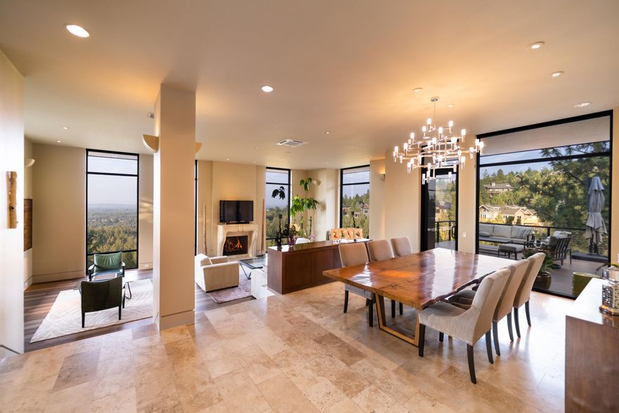 This stunning timeless modern designed home sits on a 1.29 acre lot surrounded by dedicated open space that can not be built on which offers the ultimate privacy. Top of the line (ICF) construction,Ecostar 100% recycled rubber roof tiles,two zone hepa filters (American Lung Assoc approved), exceeds Earth Advantage guidelines. 2 primary suites, European showers, custom stone mantels, Ceasarstone slab counters, powder w/ Italian plaster walls. Architectural low voltage lighting, remote solar shades.  Floor to ceiling windows provide sunrise to sunset stunning views and abundant natural light all day long. A chef's kitchen includes a Wolfe gas range, Sub Zero fridge and a butlers pantry with a second Bosch dishwasher. The kitchen island has a  custom granite slab waterfall countertop. The large upper deck is ideal for entertaining and outdoor living. On the lower deck a Bullfrog Hot tub and Custom Finnish Sauna, Main floor living, Radiant floors throughout including the large 3 car garage