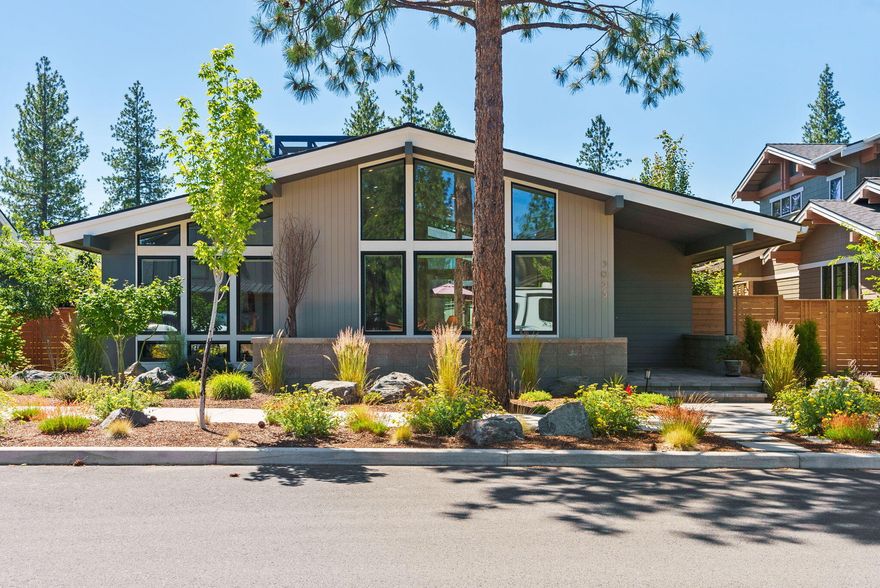 Built around a private central courtyard, this Discovery West gem includes every feature on your wish list. Gather in the inviting main living area where towering ceilings and abundant windows allow natural light to fill the room. A truly appealing kitchen offers all the storage you could need, a spacious center island, stainless appliances and seamless access to the fully fenced outdoor living area.  You'll love this primary suite, designed with vaulted ceilings and generously sized spaces including the luxurious bath with a spacious glass and tile shower. This single level, low maintenance home is Earth Advantage certified and includes an oversized two car garage with vaulted ceilings. Just around the corner from miles of trails, neighborhood parks, schools and all the amenities of Discovery West, including the newest location of Sparrow Bakery, this unbeatable location is ideal for launching your next Bend adventure.