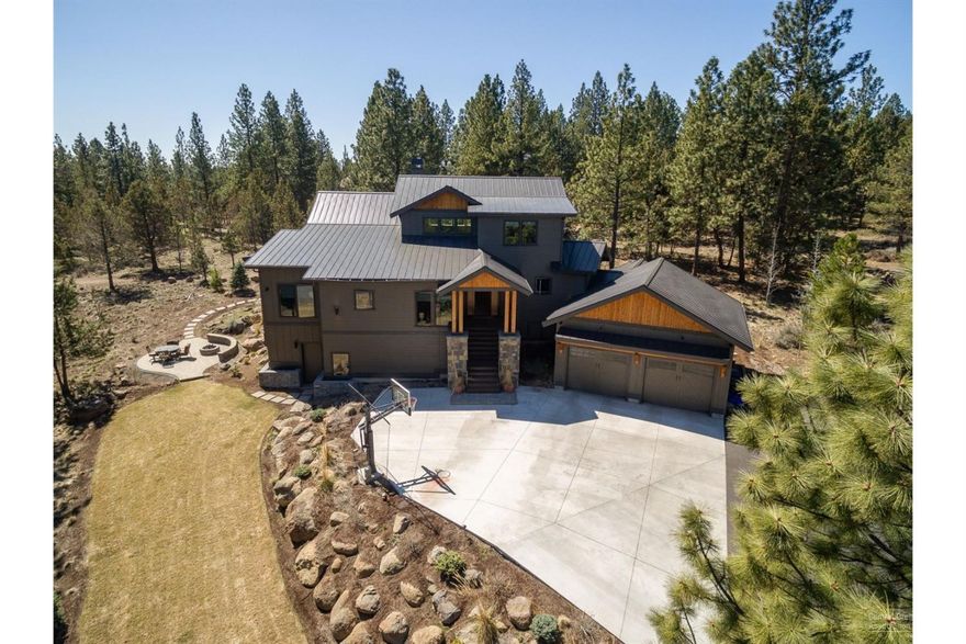 Step into the extraordinary at this luxury Awbrey Butte home. The gorgeous great room is centered by the floor to ceiling stone fireplace with views of pines all around. White quartz counters & stunning island, high end appliances & walk-in pantry create the dream kitchen. The main floor master wing begins in the large office to the luxury bath with spa amenities: steam shower, soaking tub, double vanities & the ultimate closet. The bedroom itself is very private and generous too. Main floor guest suite, 2 upper bedrooms & a huge lower level bonus room for movie night and activities!<br>