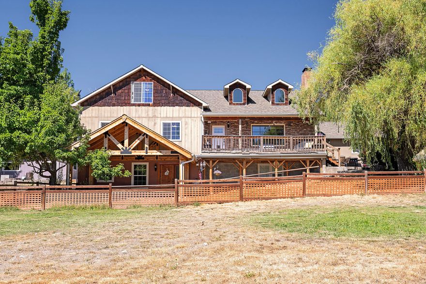 Country Equestrian Comfort Meets Multi-Family Living

This Craftsman-style ranch sits on 5.67 acres of pristine property in Trail, Oregon, offering a rare blend of space, flexibility, and rural charm. The lower level is a full second residence with its own kitchen, laundry, living room, fireplace, and private entrance—ideal for multi-generational living. Covered patios in every direction invite relaxation and connection to the land. A fenced pasture with fruit trees is perfect for horses or gardening, while the detached shop and workshop, carport/barn with two finished rooms, and a separate outbuilding for equipment, stalls, or utility use expand your options.

Well and septic in excellent condition

Well-insulated for comfort and efficiency

Flat, usable land with privacy and potential

A lifestyle property built for those who value space, purpose, and possibility.