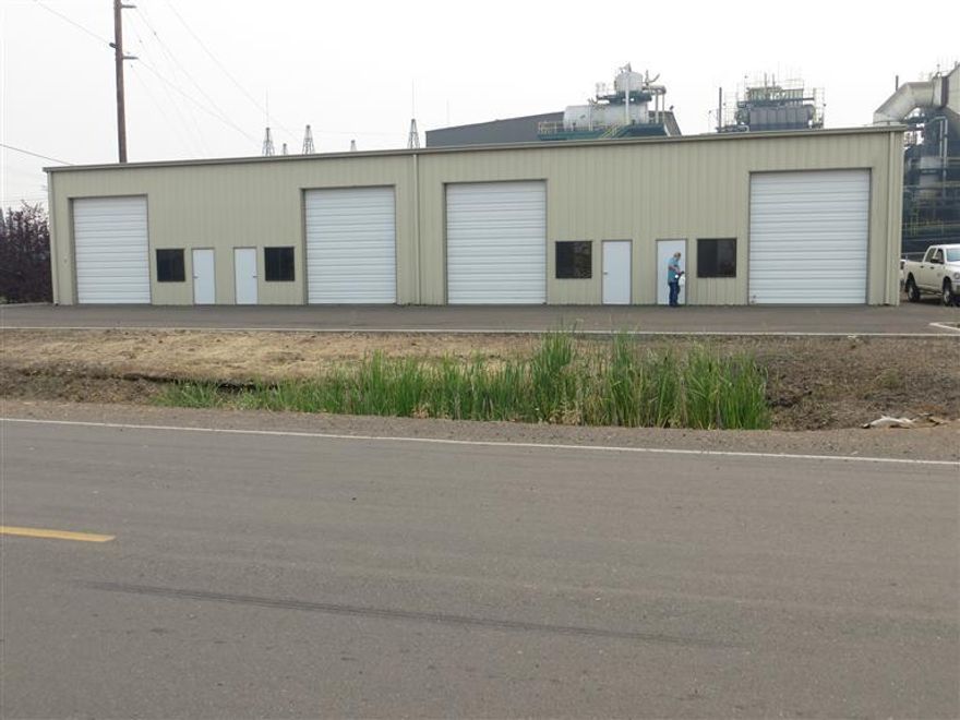 Newer commercial building with many possibilities. Zoned GI, allows manufacturing, storage, distribution and much more. 5200 sq ft building or split into 2,3,4 units. Four 12ft by 14ft rollup doors and four man doors. RVSS is connected fee not paid as yet. Set up for 4 bathrooms. Electric panels set up inside and outside with electric available. Owners will consider all reasonable offers, and may owner carry with large down.