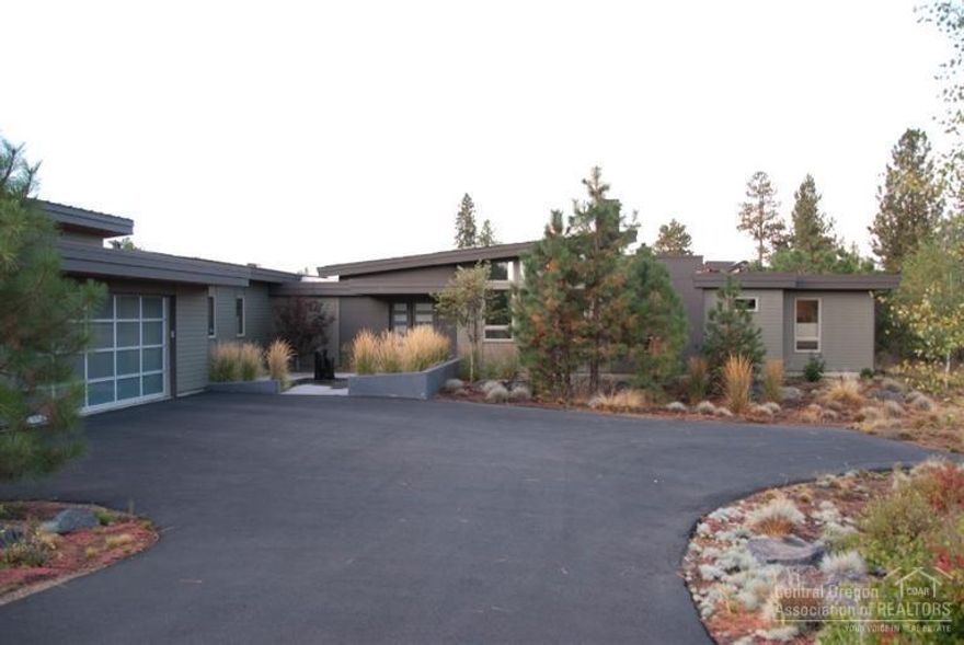 This contemporary designed home is certified Earth Advantage Platinum. It features 8 inch exterior walls,14 inch insulated ceilings, radiant floor heat throughout the home and garage with individual room controls, beautiful gourmet kitchen with large island and breakfast bar, stunning views of the Tetherow golf course and Mt. Bachelor, large pantry and mud room. Home features mostly LED lighting with RF total home lighting controls. This home was designed to be extremely efficient and full of light.