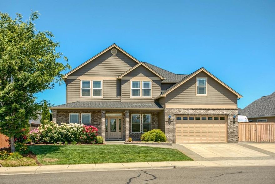 Stunning executive home in Blue Grass Downs! Gorgeous kitchen with 3 cm chiseled granite countertops, beautiful oak cabinets, tile backsplash, instant hot water, custom pull out spice rack, trash compactor & central vac dust pan. GE Profile Series appliances 5-burner gas cooktop, double ovens (one convection), refrigerator & dishwasher. A huge 6x7 panty & tons of storage make this kitchen a dream. 9ft. ceilings throughout. The downstairs has rustic maple floors & they are beautiful. There is a bedroom, full bath & an office w/built in desks downstairs. The upstairs has 3 more bedrooms, bonus room & 5th bedroom which was designed to be a theatre room. The master suite is very spacious & includes a large walk-in closet. The master bath has a rain shower, jetted tub, cultured marble double sinks & tile floor. The backyard is lush & beautiful w/ a covered patio w/fan & wired for sound. The garage is extra deep & the r.v parking is huge! Plus, the park is directly across the street!