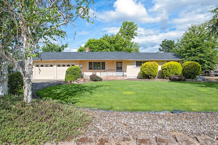 This Central Point 3 bed, 2 bath home brings a rare opportunity to own a large .46 acre lot with a shop and the convenience of living in town. You will find ample covered and uncovered parking for RVs and all of your vehicles and toys. The large Black Walnut and other mature trees provide cool shade in the backyard and there is plenty of space for playing and gardening. The shop has built-in storage, room for a vehicle and a separate space for working/storage. Inside the home you will find a nice, open kitchen and two living areas - one with a gas fireplace and one with a woodburning stove. The master bedroom is spacious with an ensuite bath, a walk-in closet and access to a private patio that would be great for a hot tub or a quiet outdoor retreat. This is a great property! Come and see it today!