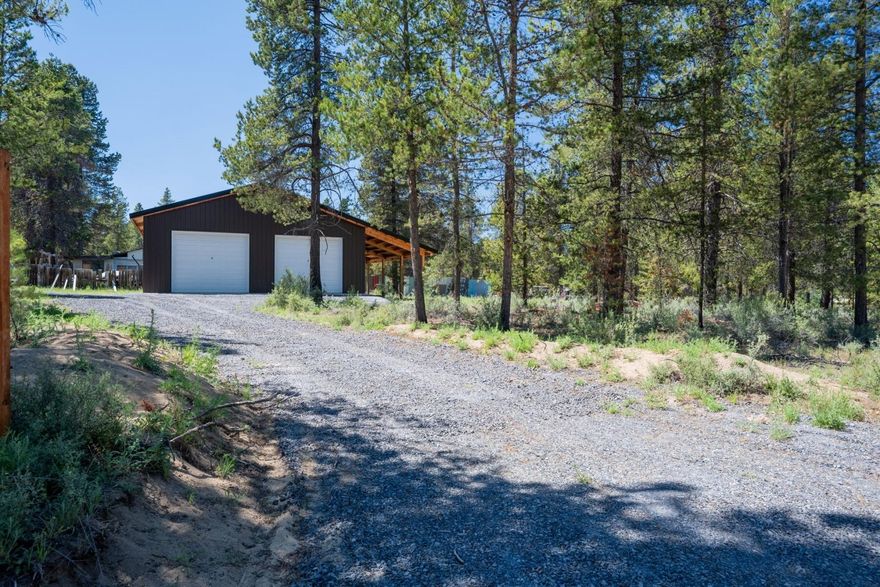 Discover your perfect getaway on this beautiful corner lot nestled between the Deschutes River and Little Deschutes, just blocks from La Pine State Park. This prime recreational property offers unparalleled access to year-round outdoor adventure—whether you're into fishing, hiking, kayaking, golfing, or skiing, it's all right at your doorstep.

The level lot is dotted with majestic ponderosa pines and has been thoughtfully cleared of brush, creating a serene, park-like setting. A quality-built 36' x 36' shop provides ample space for gear, hobbies, or future projects. With two permitted gravel driveways, a carport, and designated RV parking, there's plenty of room for all your recreational vehicles and toys.No septic is allowed per current guidelines—buyer to perform due diligence. Whether you're looking for a basecamp for adventure or a peaceful place to relax in nature, this property delivers exceptional value and versatility.