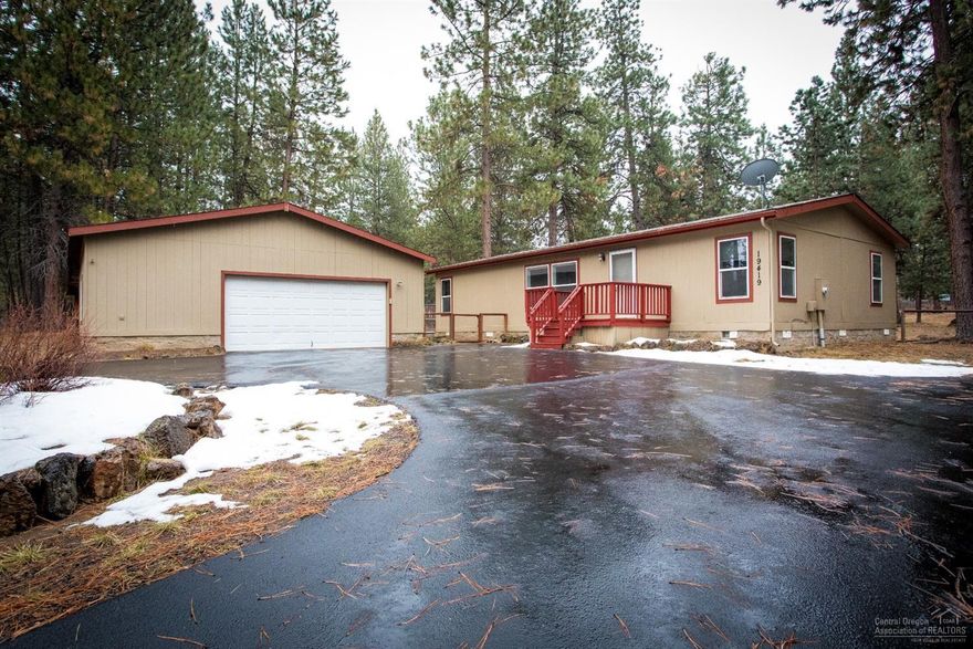 Room for everything! Enjoy this lovely 3 bedroom, 2 bath home on .92 fenced acres. Home has laminate flooring, built-in dog door, new blinds in the vaulted living room, and includes all appliances. Great outdoor patio for grilling and entertaining. The oversized, 2 car garage is perfect for all your gear! There's even additional covered parking for a trailer, boat, or toys. Horseshoe paved driveway has additional room for RV parking. Easy access to Hwy 97 on paved roads. This home offers a quiet escape in the pines of Deschutes River Woods!