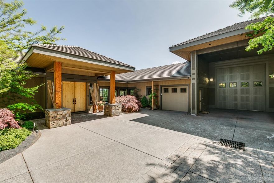 Brilliantly designed custom river front home in Bend! Perched on the Deschutes River Canyon w/stunning river, canyon & mountain views. Private and peaceful! Modern NW Contemporary style offers 3 full master suites, great room w/fireplace, hickory floors, chefs dream kitchen w/72 sft island! 4 private decks. Sauna. 1330 sft RV suite with guest quarters. Meticulously constructed with attention to every detail.