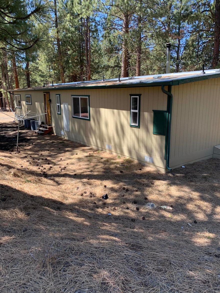 Private 2 bedroom, 2 bath home on 2.31 acre lot at the corner of White Horse and Solomon.  Large insulated shop with overhead door and sliding door for your vehicles and toys.  Hickory cabinets in kitchen.  Island with pendant lights and bar seating.  Newer well pump.  Appliances included.  Seller states that lot to west is not buildable, so privacy should be assured.