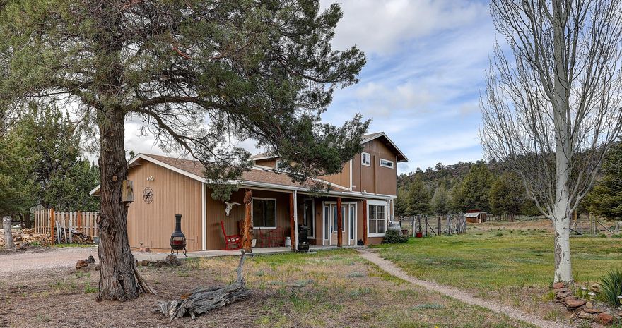 Tucked in on five acres in Redmond's Odin Crest Estates, this private retreat backs to BLM land and features 3 bedrooms + office, 2 baths and a separate ADU above the detached garage - perfect for passive income or multi-generational living. The custom 2,200 sq. ft. home features a beautifully updated kitchen with quartz countertops, hickory cabinetry and stainless-steel appliances. Enjoy the open floorplan on the main floor with newer plank flooring, cozy living room with woodstove, media room, and two bedrooms. Large upstairs bedroom includes en-suite bath with soaking tub, radiant heat floors and walk in closet. Hand crafted juniper staircase and wood beams accent the home highlighting the care and thoughtfulness put into this home. Don't miss the greenhouse with established herb garden, fenced area for dogs, Trex decking off back bedroom, woodworking shop in oversized garage and abundance of land to develop how you wish!