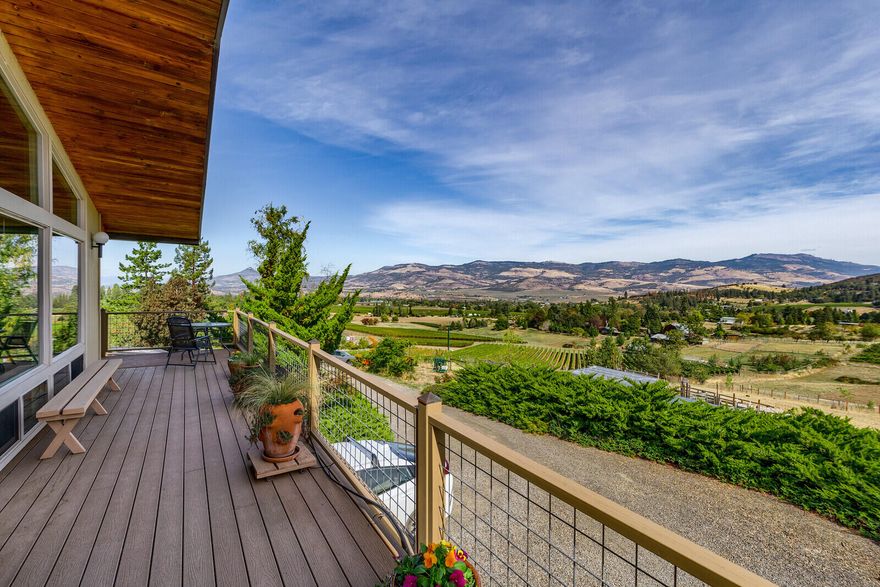 Oh man, I love it when a plan works. Nature had a plan to create one of the most scenic locations in this valley. The current owners executed their plan to replace all the windows and totally remodel the kitchen. After experiencing this PLACE, you may want to plan on making this beautiful home your own. Your neighbors are grapevines for local wineries. The views are simply extraordinary. Take in those views on one of the new decks in the sun or choose a spot in the shade. Solar panels feed storage batteries under the house, and a whole-house backup generator provides a backup to that backup. LOTS of storage. Main level living, plus a bedroom/office downstairs with its own bathroom. Many raised garden beds with irrigation. (Seller produces so many fruits and veggies she donates regularly to the food bank.) Pollinator garden, 7 gpm well. Zoned for farm use with TID irrigation from both above and below. Easy access to town but feels WAY out in the country. What's your plan?