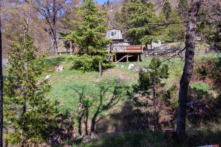 Are you looking to be just a few minutes from Ashland and out in the woods?  This property is for you.  Beautiful wooded views on 3+ acres.  There is even a slight view of Immigrant Lake on the property.