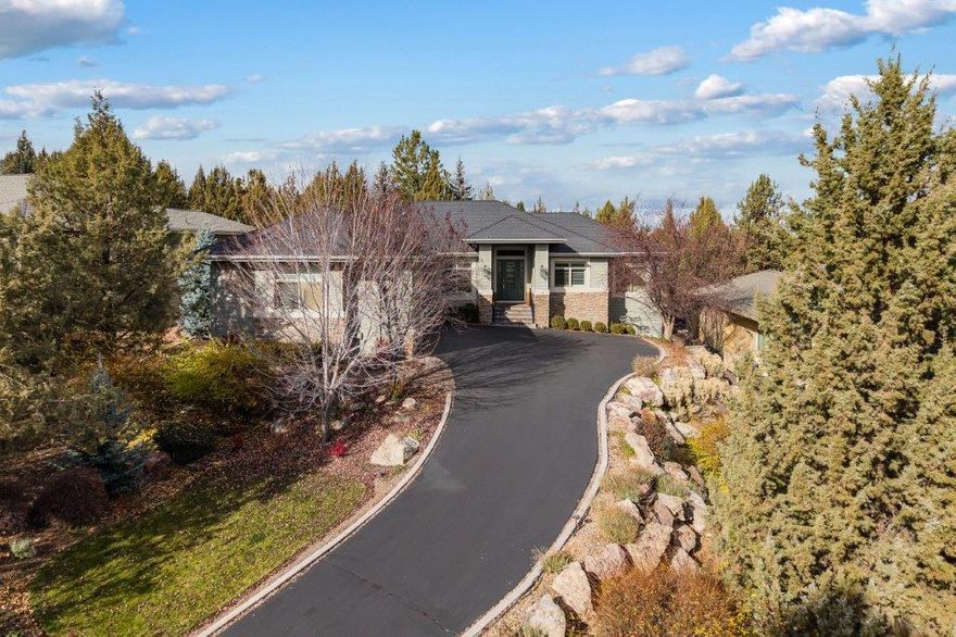 Located in the prestigious 55+ Eagle Crest Community, this beautiful home offers privacy and picturesque views of the Challenge Course and Eastern Mountains. The rear court yard is composed of pavers and a large Pergola for extra privacy. Enjoy the open-concept layout featuring a spacious kitchen with custom gas range, pantry, large island for entertaining, and a cozy propane fireplace. The formal dining room is ideal for hosting, with a half-bath down the hall for extra convenience. Unwind in the luxurious primary suite, complete with soaking tub, walk-in shower, and double vanity. The other bedrooms on the opposite side of the house, share a Jack and Jill bath. There is a dedicated office space in. A large 3-car garage with lots of room. The expansive lot completes this perfect retreat. Live the active lifestyle with all the amenities Eagle Crest has to offer.