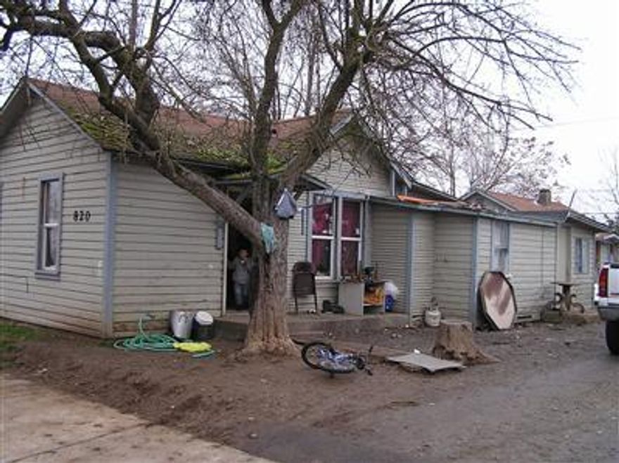 3 units on a four plex lot. Architectural site plan commission has issued final order approval for a new 4 plex structure on site. Final order approval & plans to be included with sale. 2 units currently occupied, 1 vacant. Rents are $415. for 812 sq. ft. 2 bed, 1 bath, $385. for 696 sq. ft. 1 bed, 1 bath, and $325 for 347 sq. ft. 1 bed, 1 bath. Sold AS-IS''.