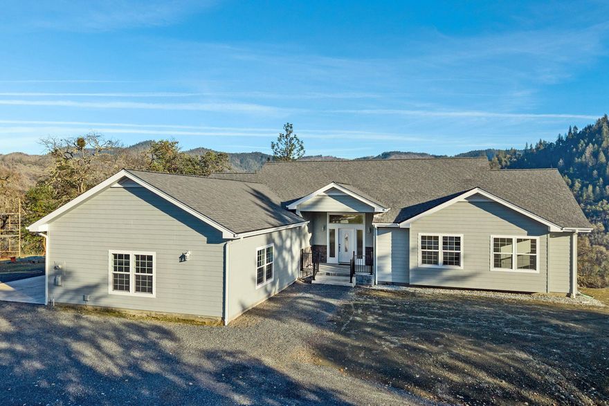 Brand new mountain top home on 5 acres at the end of a gated private driveway with 360 degree views of forests and mountains! Spacious 2184 sq ft open floor plan with vaulted ceilings, 3 BR 2.25 BA with a large primary suite, Chef's kitchen with high end appliances, expansive decks, a large laundry area and spacious 962 sq ft attached garage/shop. There is also a 2154 sq ft partially finished basement that can be used for storage or expanded living space.  The 5 acres has approximately a half acre of flat ground that can be further developed into shop space or large vehicle/RV parking.
