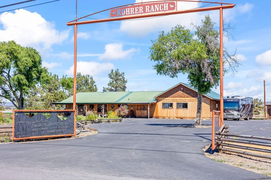This property not only has everything Powell Butte has to offer but more. For starters the 3032 SF home features 3 bedrooms, 2 full baths & 2 half baths. Great room concept w/large breakfast bar, spacious dining area & kitchen built to entertain.  Kitchen includes 6 burner range w/double ovens, granite counters & enormous butler's pantry w/ additional work space. Primary bedroom is large w/ room for exercise equip. & existing sauna.  In addition there is a large, vaulted game room w/outside access & it's own bathroom. Perfect space for dual living. For the occasional guest you have a 2 bedroom guest house w/ full bath. Under 3000+ SF of roof is a shop w/110, 220, & 3 phase power, & large walk in freezer. Plenty of space for projects, classic cars or maybe a business?  74 acres w/ 65 acres of gravity fed, flood irrigation. No pumping charges. The property is fenced & cross fenced with barn w/hay storage & 5 stalls. Paved drive & ample parking. Fabulous mountain views!