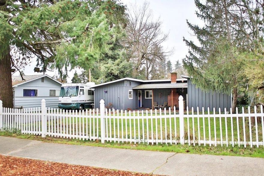 Enjoy the charm of this 4 bedroom, 2 bath home conveniently located in North East Grants Pass. This is a single story home with a split floor plan and features real knotty pine wood paneling in the kitchen, dining room and living area. In the kitchen you will find plenty of cabinets and counter space for ease of cooking and built in corner hutches in the dining room which add that special touch. The living room boasts a wall of windows to let the natural light in and has beam ceilings that accent the woodwork and built in book shelves. French doors lead from the master bedroom to the covered patio in the back yard. Large laundry and mud rooms with a separate entrance and access to the 4th bedroom which would also make a great home office. Outside you can enjoy two patios, mature landscaping, private back yard, water feature and garden beds. There is also a detached 24 x 28 garage with work bench and RV parking. Close proximity to schools and shopping with city services.