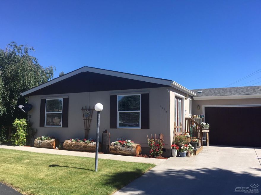 This is a home you don't want to miss! 1404SF, 3bdrms/2Ba, great room, vaulted ceilings, fresh & bright living are loads of natural light. The cul-de-sac location on a large lot w/RV hookup. New beautiful vinyl Shaw Denver Wellington Resilient vinyl plank flooring, new carpet, large kitchen w/corner pantry, new appliance, new interior paint. Refreshing & lovely home w/attached dbl garage. If you are 55+, this community is delightful, well managed, & perfectly located near shopping, schools & medical.