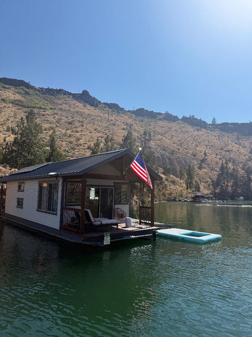 Rare Lakefront Gem on Lake Billy Chinook - Metolius Arm

Don't miss this unique opportunity to own prime waterfront property in the tranquil Fly Creek Cove on the Metolius Arm of Lake Billy Chinook. This offering includes Houseboat Slip #2—a coveted end slip in Lot 11 at Fly Creek—along with two deeded, dedicated parking spaces and the fully built from top to finish in 2018 floating home
Completely renovated from the ground up, the houseboat features a stylish, modern interior with:
• 1 private bedroom with a queen bed
• Built-in twin bunk beds
• Full bathroom with shower
• Designer kitchen with quartz countertops, propane stove & oven, refrigerator, microwave, and dishwasher
Solar powered for off-grid living, this floating retreat blends comfort, function, and adventure. Wake up to serene water views spend your days exploring the lake, and unwind with unforgettable sunsets—all in the heart of Central Oregon's high desert paradise. Lake life awaits with this rare one of-a-kind
