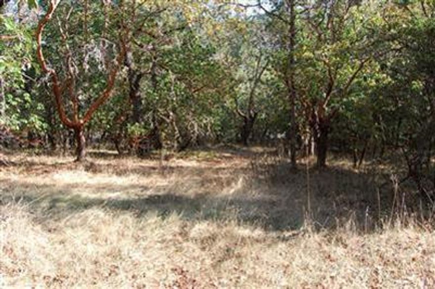 Own your own piece of beautiful southern Oregon. This beautiful parcel is ready for your custom home. Well (well log shows 8.5gpm) & septic are installed. Private setting among the trees. Conveniently located just a short distance to schools, easy freeway access, golf course and the river. For those that love the water, the property is located within miles of the Rogue River; great fishing, rafting, jet boat excursions & many creeks and trails to explore. Owner will carry, call for terms.