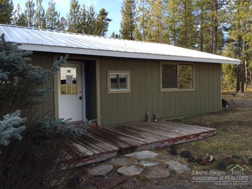 With a little love & care this property is the perfect opportunity for rural living close to all the recreation Central Oregon has to offer. Located right off the paved road on a private treed 1+ acre lot with outbuildings for RV's and vehicles. Fenced on 3 sides. Permitted garage with non-permitted guest quarters. Sold as is and where is with no warranties expressed or implied. Buyer's responsibility to verify all permits and property information.