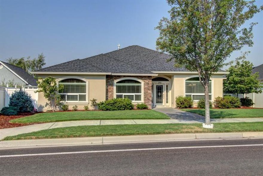 The light and bright open floor plan provides a sense of welcome home the moment you enter this beautiful home in the Eagle Point Golf Course Community! The large great room with vaulted ceilings, formal dining room and casual eating area makes for perfect entertaining! Glass doors open to office off of entry way. Hardwoods in kitchen, casual eating area, office, and wide hallways. Spacious master suite with adjoining bath featuring double sinks, soaking tub, and large walk-in closet with built-in shelving. Fans in all bedrooms and great room. Double sinks in second bath. Kitchen has slab granite and stainless steel appliances. Laundry room has sink and extra cabinets. Beautiful landscaping and large covered patio with electric awning provide a perfect place for enjoying morning coffee or outdoor entertaining. Garage has a bank of high quality storage shelving. This home offers comfort and beauty in a quiet and serene area! Don't miss this one!!!