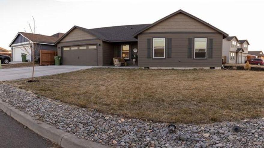 This beautiful single level home was built by Simplicity Homes in 2018. The open kitchen looks into the spacious living room and formal dining area under vaulted ceilings, providing ample room for relaxation and entertainment. Four sizeable bedrooms- one of which may be used as an optional den-are located down a private hallway and share a full bathroom. They are far removed from the privacy of the expansive master bedroom, which features a dual vanity bathroom and private water closet. The white cabinetry and quartz countertops create a bright modern look. All interior doors have been upgraded to soundproof. The garage is insulated and dry walled. This home is on a spacious corner lot (.21 acres) that leaves plenty of room to add a greenhouse, storage shed, garden area, park toys or whatever use you may require. New owner can finish fence with a gate and/or extra space in the front or back yard.